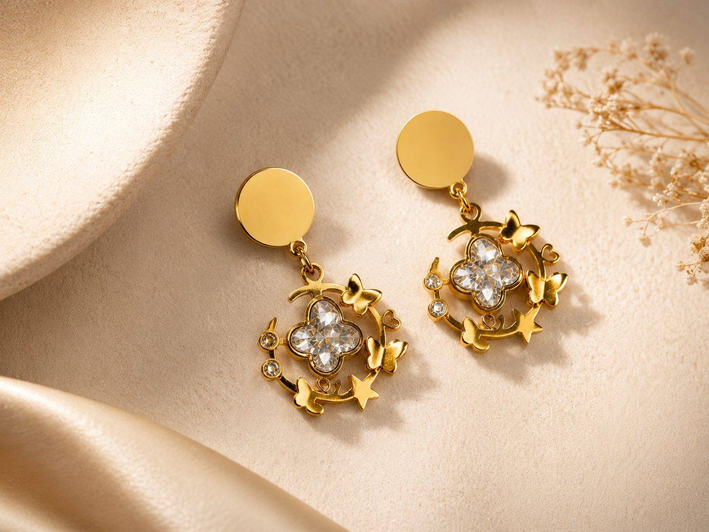 Vien Gold-Plated Drop Earrings Feature a Sparkling Crystal Quatrefoil Motif Surrounded by Delicate Butterflies